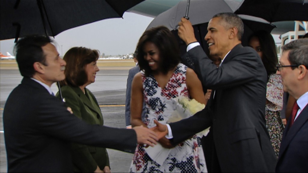 Video grab from Cuban TV of US President Barack Obama (2nd-R) next to first Lady Michelle Obama (C), greeted by Deputy Director for American Affairs in Cuba's Foreign Ministry, Gustavo Machin Gomez (L), next to Cuban Foreign Minister Bruno Rodriguez (R) and the head of the U.S. division at the Cuban Foreign Ministry, Josefina Vidal (2nd-L), upon the Obamas' arrival at Jose Marti international airport in Havana on March 20, 2016. Barack Obama on Sunday became the first US president in 88 years to visit Cuba, touching down in Havana for a landmark trip aimed at ending decades of Cold War animosity. AFP PHOTO / CUBAN TV / AFP / CUBAN TV / --