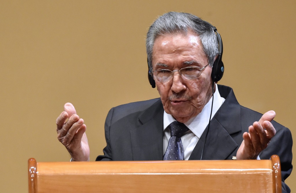 Cuban President Raul Castro gestures as he delivers a joint press conference with US President Barack Obama (out of frame) after a meeting at the Revolution Palace in Havana on March 21, 2016. Cuba's Communist President Raul Castro on Monday stood next to Barack Obama and hailed his opposition to a long-standing economic "blockade," but said it would need to end before ties are fully normalized.   AFP PHOTO/Nicholas KAMM / AFP / NICHOLAS KAMM