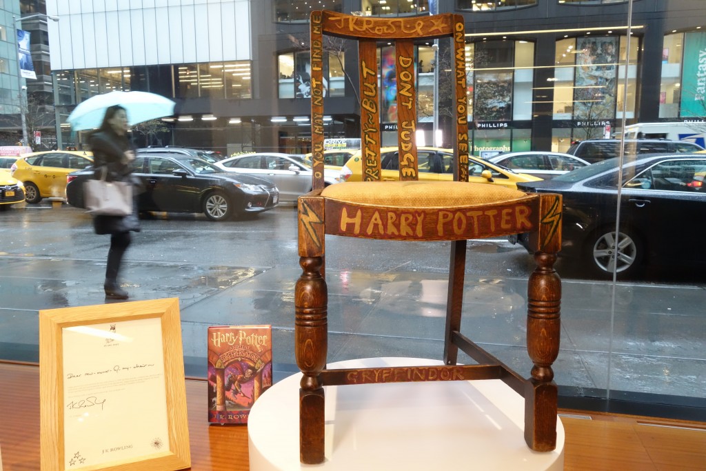 A chair used, and later decorated, by author J.K. Rowling while she wrote the first two Harry Potter books on display alongside a letter of provenance from the author at Heritage Auctions in New York on April 4 2016 ahead of its sale on April 6.                                 / AFP / William EDWARDS