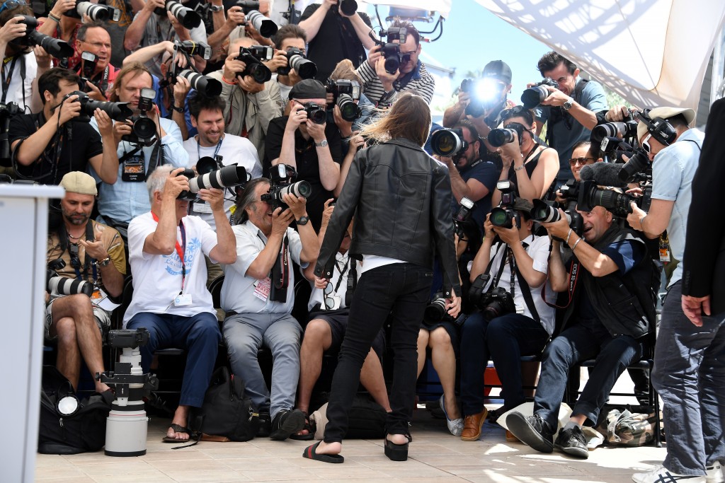 US singer Iggy Pop poses on May 19, 2016 during a photocall for the film "Gimme Danger" at the 69th Cannes Film Festival in Cannes, southern France. / AFP PHOTO / ANNE-CHRISTINE POUJOULAT