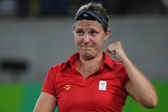 Belgium's Kirsten Flipkens reacts after winning her women's first round singles tennis match against USA's Venus Williams at the Olympic Tennis Centre of the Rio 2016 Olympic Games in Rio de Janeiro on August 6, 2016. / AFP PHOTO / Luis Acosta