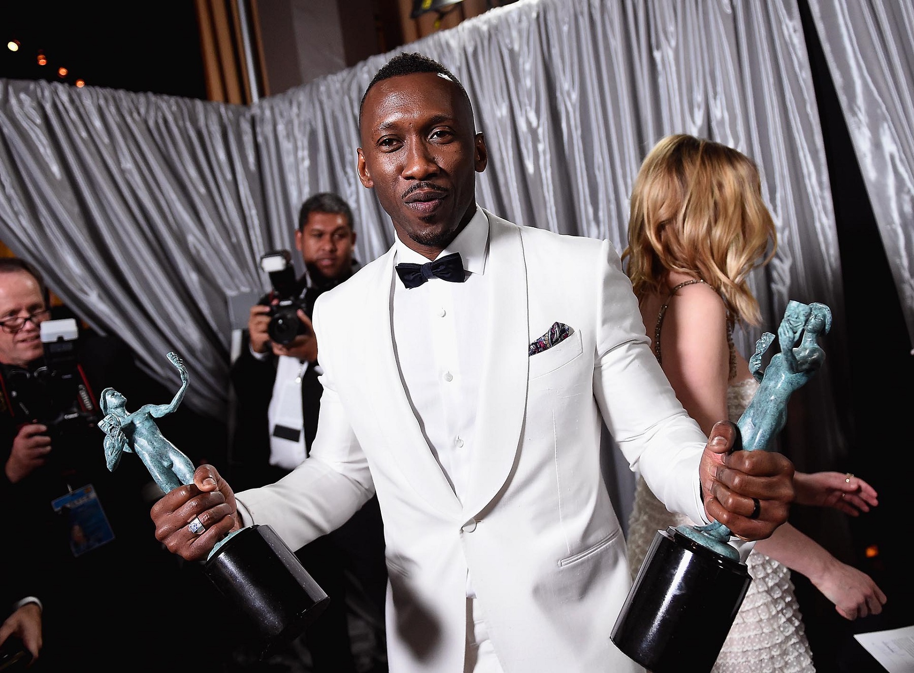 LOS ANGELES, CA - JANUARY 29: Actor Mahershala Ali, winner of the awards for Outstanding Male Actor in a Supporting Role for 'Moonlight' and Outstanding Cast in a Motion Picture for 'Hidden Figures,' poses with awards backstage during The 23rd Annual Screen Actors Guild Awards at The Shrine Auditorium on January 29, 2017 in Los Angeles, California. 26592_017 Matt Winkelmeyer/Getty Images for TNT/AFP