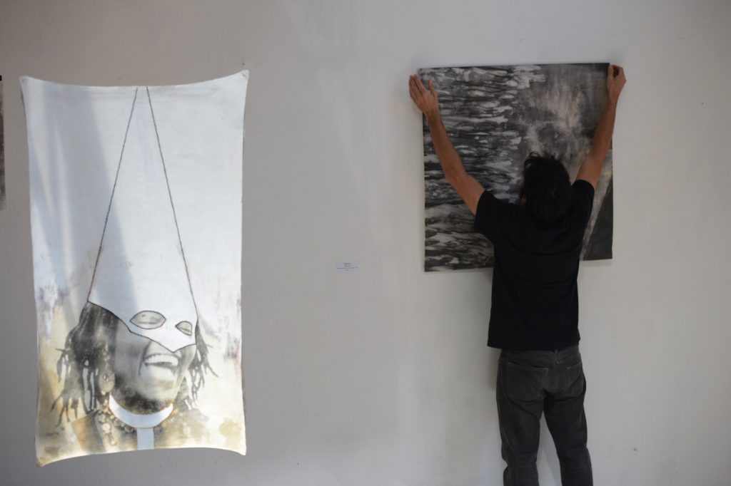 French photographer Nicolas Guyot during his exhibition 'Imagenes de lo insondable" (Images of the unfathomable) in Tegucigalpa on March 21, 2017.   Guyot's work includes images taken in Syria, Congo and Nepal, among other scenarios, processed using film techniques and silver bromide development. / AFP PHOTO / ORLANDO SIERRA